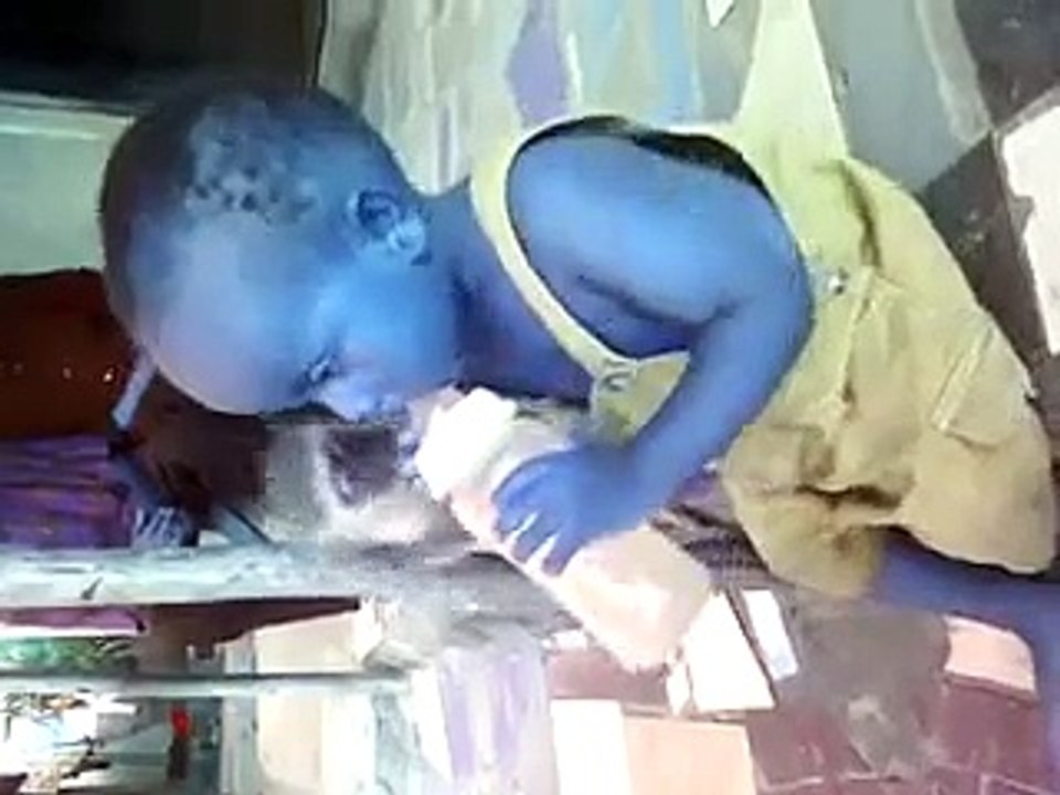 blue kid playing with monkey