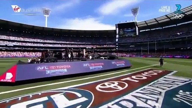 Lip-syncing? Ellie Goulding performs at the AFL Grand Final