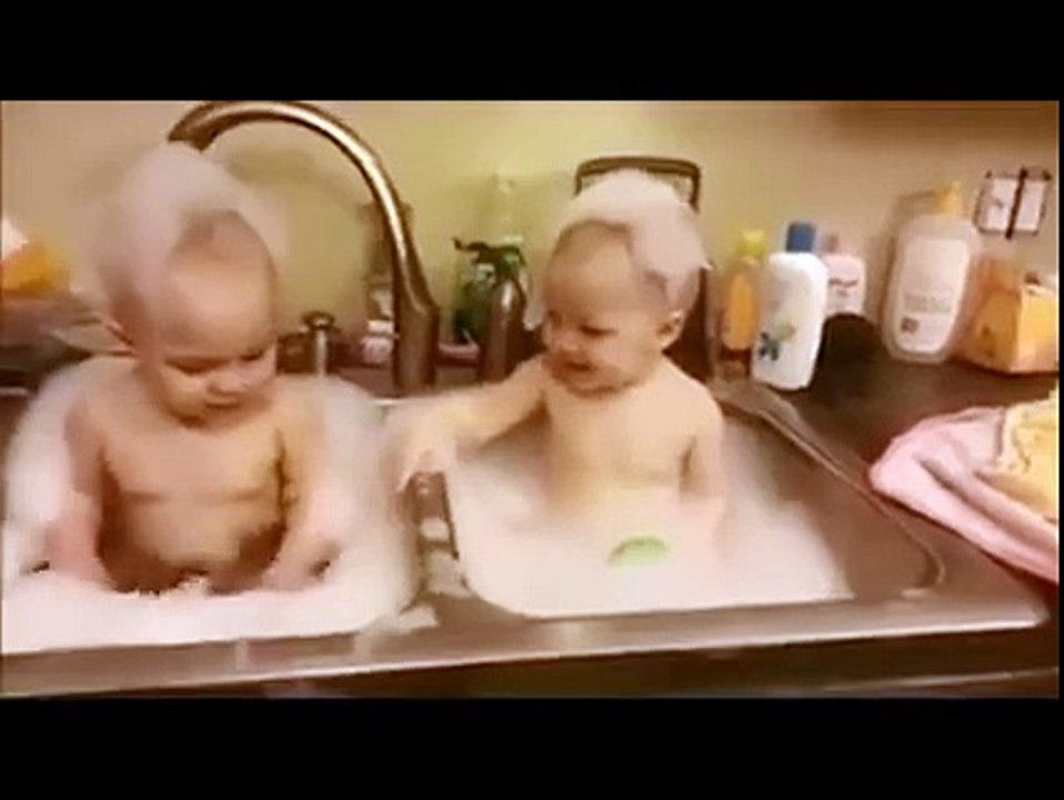 Adorable Twin Having Bath