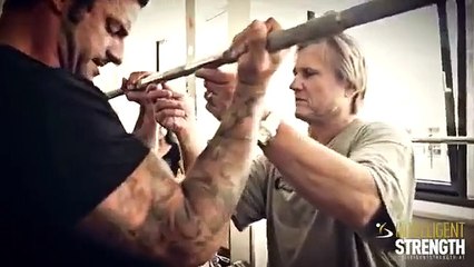 Biceps exercise looks very painfully - the coach is a pressure!