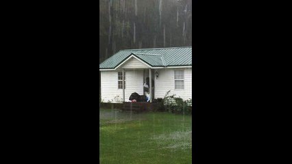 Man gets creative to walk through flooded garden