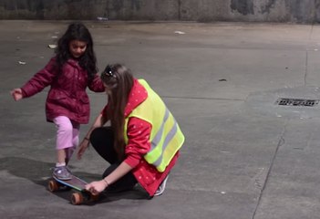 Volunteers Show Kids How to Skateboard Near Hungary-Austria Border
