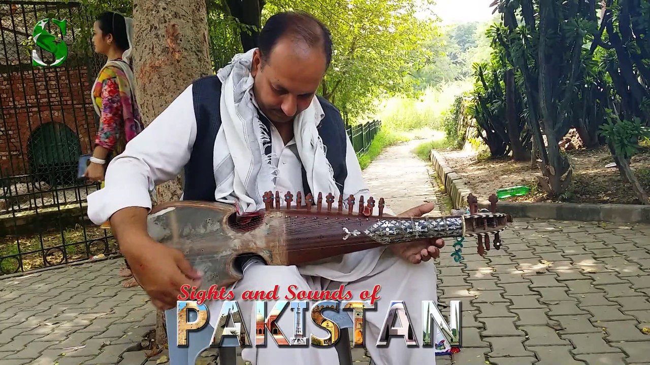 Rubab Instrument played by a Pakistani man at Daman-e-Koh garden ...