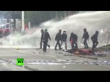 Police use water cannon against anti-austerity protesters in Brussels