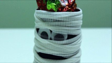 Easy Halloween Crafts for Kids Making A Ghost Candy Holder out of Plastic Bottle