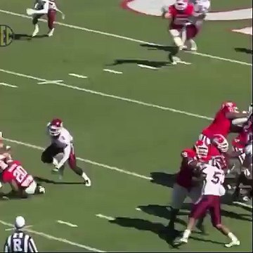 Football Player Dives Into Bushes