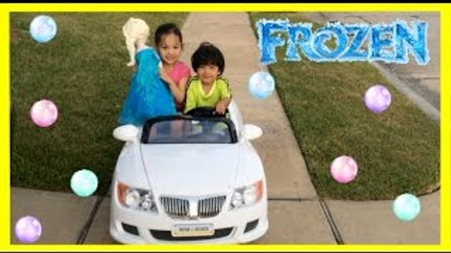 Kid Playing Outside riding car blowing bubbles with Giant Frozen Elsa Doll Ryan ToysReview