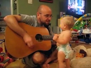 omg ..too cute ... lil rockstar performing with his father