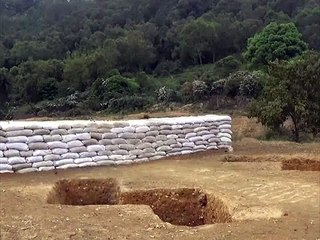 A soldier misses his throw grenade and is saved by his instructor