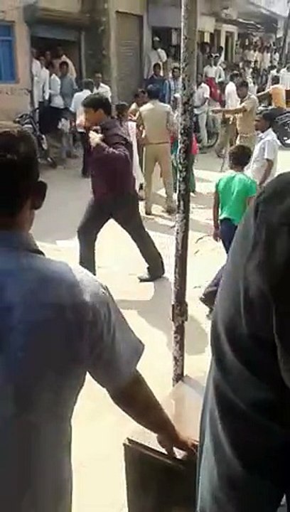 Men Removing Lady Clothes In Public