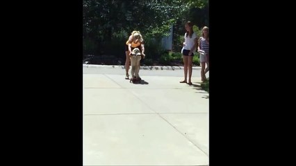 Funny dog riding a scooter!