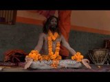 Naga Sadhu meditates during Kumbh Mela in Trimbakeshwar, Nashik