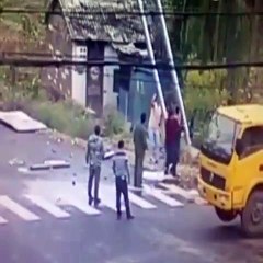 men moving street sign touches wire