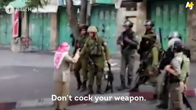 This elderly Palestinian man stood in front of Israeli soldiers to prevent them from shooting at protesters.