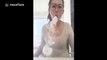 Woman blows smoke rings with e-cigarette to the beat of a dance song