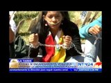 Jóvenes venezolanos se encadenan exigiendo la liberación de los presos políticos