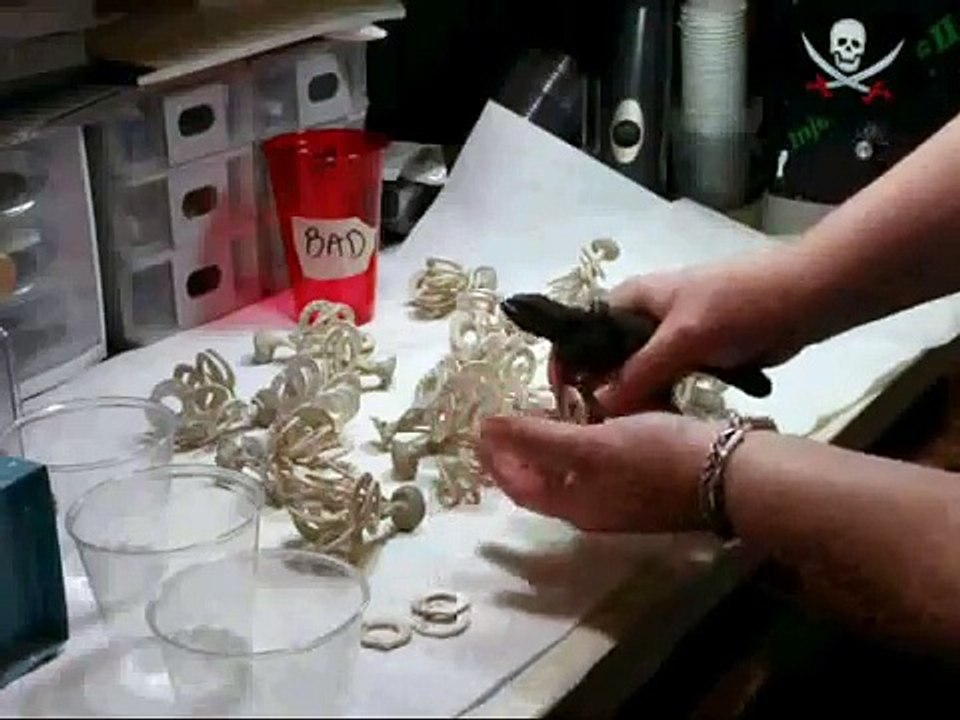 Lost Wax Casting Step 8 of 9 Cutting the charms off of the sprues