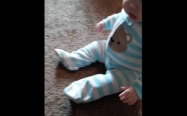 Baby Giggles At Jumping Toy