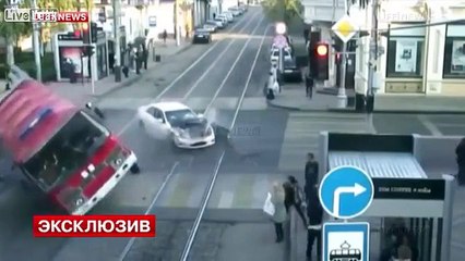 Car Crashes into Fire Truck Rolls over