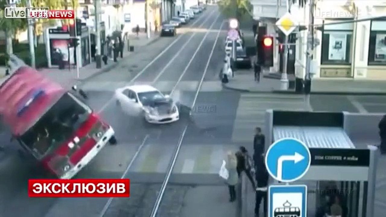 Car Crashes into Fire Truck Rolls over