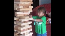Dumb kid playing Giant JENGA game : painful fail!