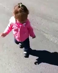 Baby surprised from her own shadow
