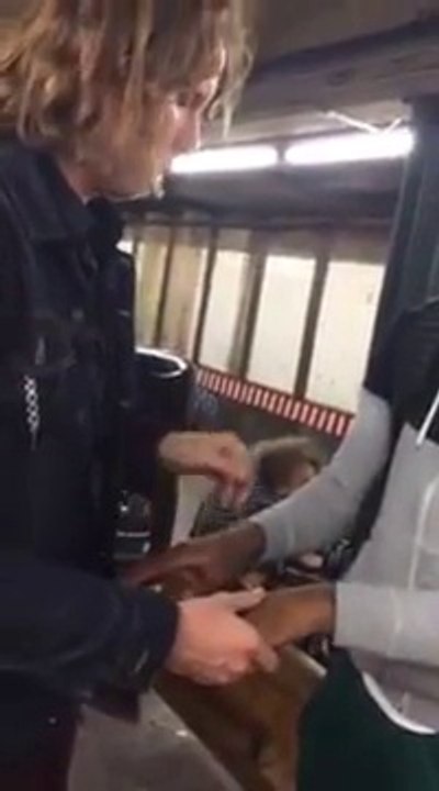 Blind magician makes an X teleport onto a spectators hand in Subway Station