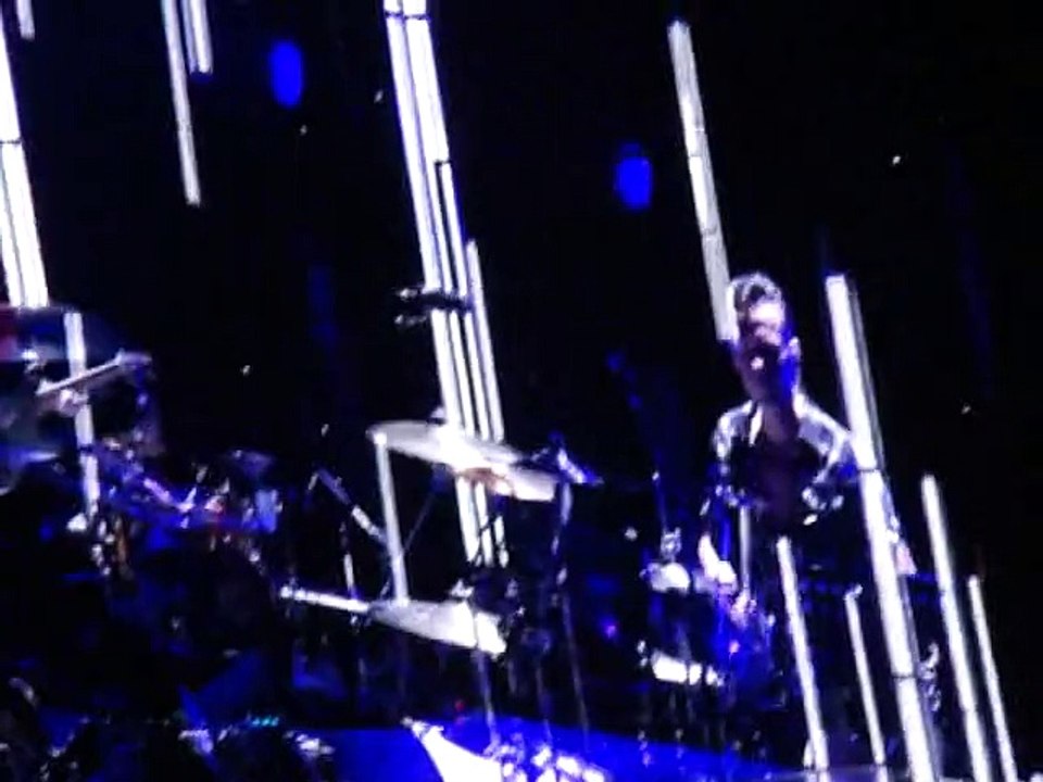 Lead Singer Bono of  U2    "With or Without You"