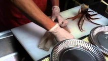 Cutting squid from alive to sashimi at Hakodate Fish Market