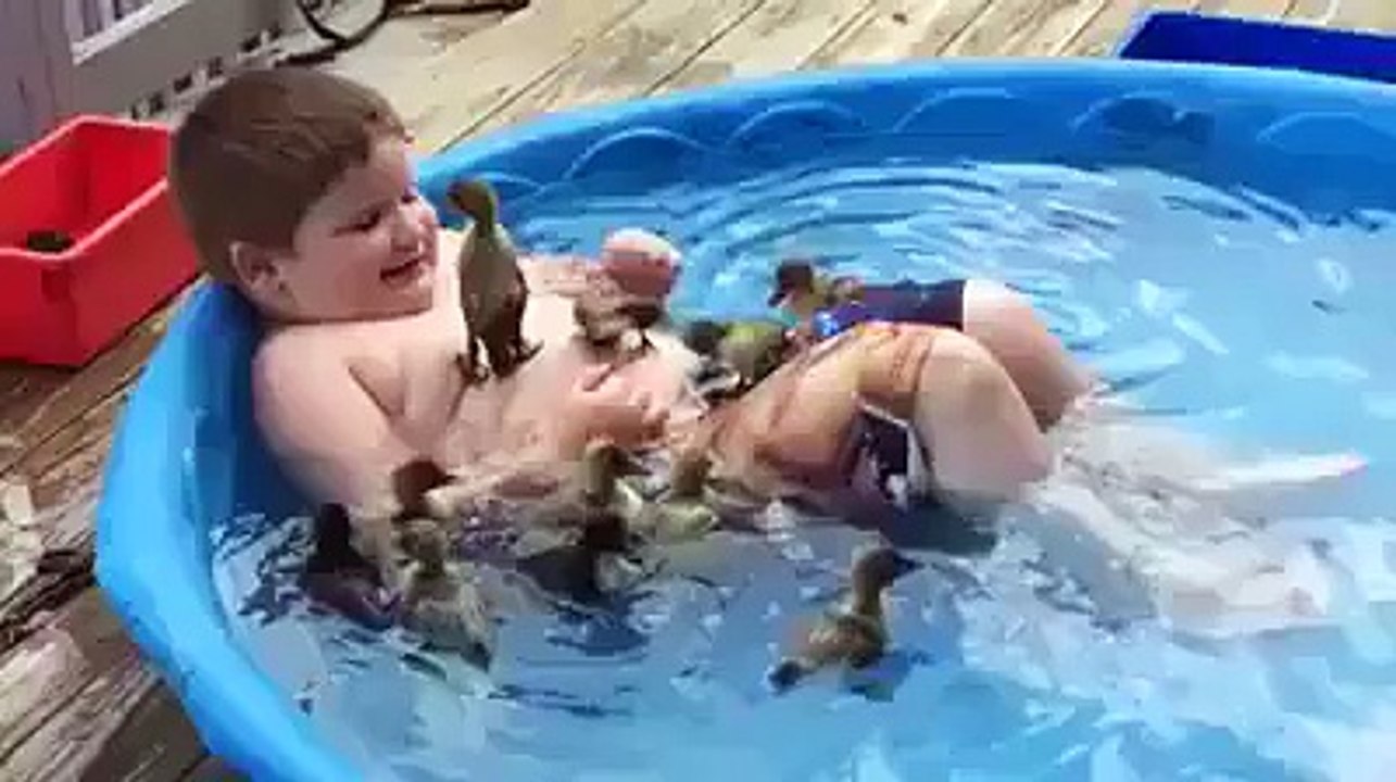small chidran with duck