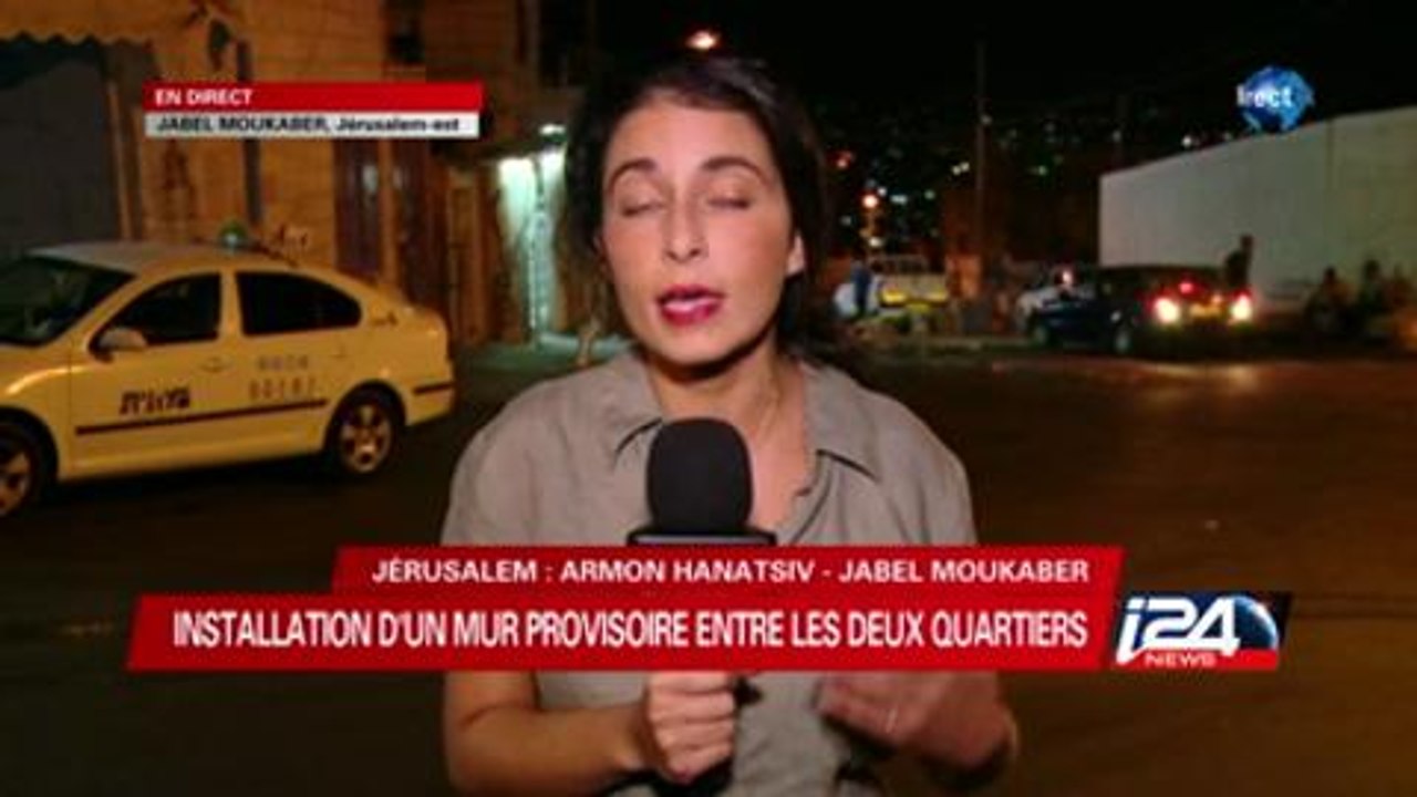 installation du mur provisoire entre les deux quartiers