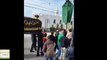 Ahmadiyya Muslims serving drinks to a Shia procession infront of Ahmadiyya Bait un Nur Mosque in Calgary, Canada.