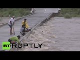 Floods & Landslides: ‘Typhoon Koppu’ slams into the Philippines