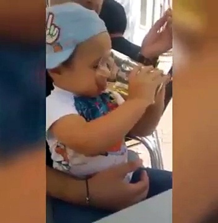 Shocking video shows child forced to drink beer and smoke
