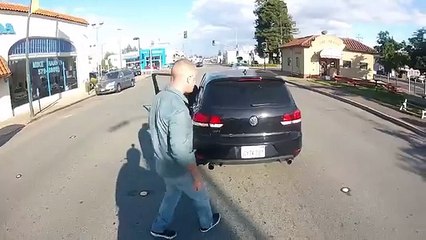 Crazy Guy hits motorcyclist Road Rage