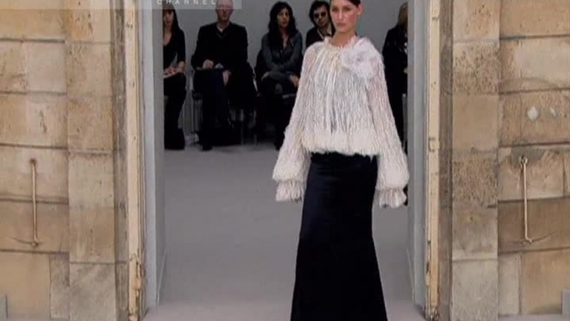 A model wears a creation designed by Karl Lagerfeld for Chanel