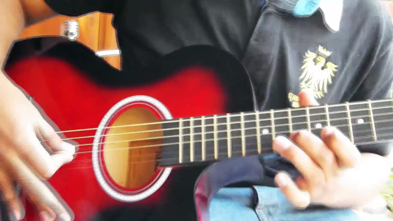 pakistani boy playing guitar