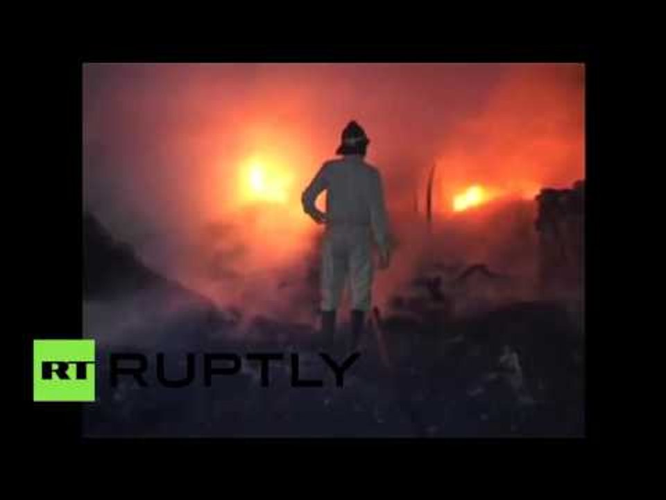 Raging inferno destroys hundreds of slum dwellings in New Delhi, India