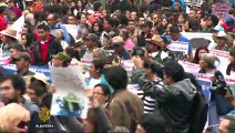 Thousands mark anniversary of missing Mexico students