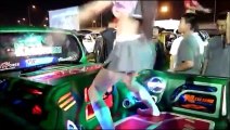 Young Thai girls schoolgirl uniform dancing on cars Coyote Motor Show