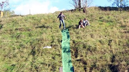 Man skis on dirt... crashes