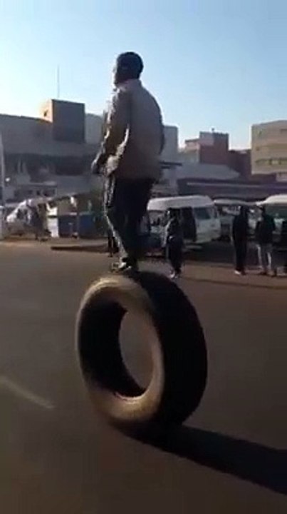 Boy riding on a single tyre