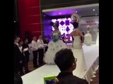 Model in wedding dress falls down during a Chinese bridal fashion show
