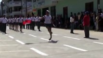 Cheerleader falls down in high heels during Valentines Day Parade