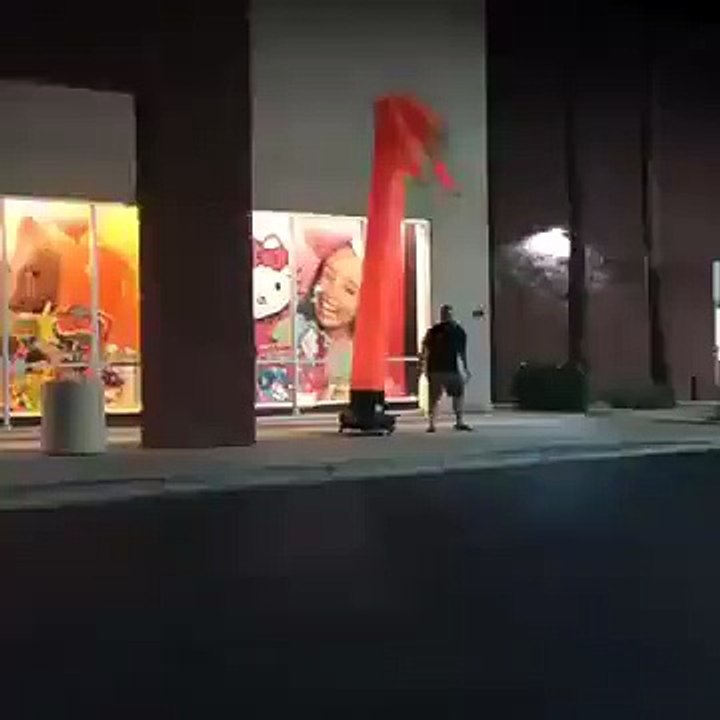 Guy Does Dance Off With Inflatable Floppy Man