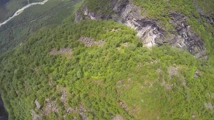 Breathtaking POV wingsuit flight over glacier