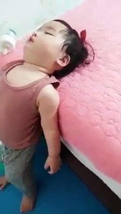 Cute Little Boy Sleeping While Standing