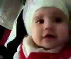 a too little baby reciting Kalma Tayyaba