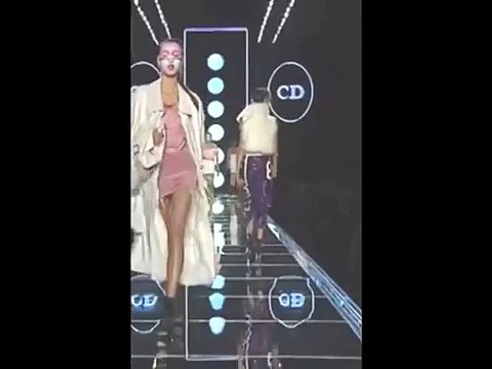 Model Bettina Weitze falls down during Dior RTW Fall/Winter 2003