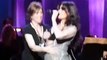 Idina Menzel suffers a (wardrobe malfunction) during a song performance